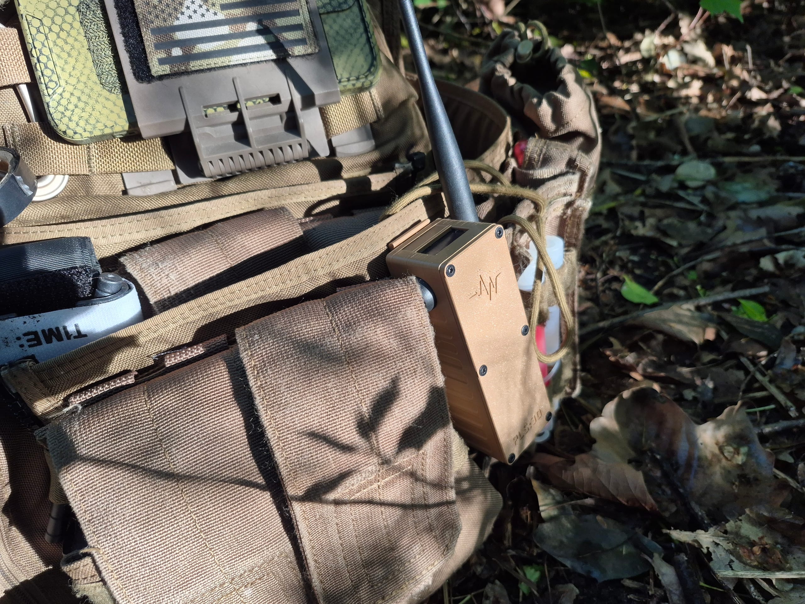 Tan RBaken on plate carrier next to flag patch in field setup