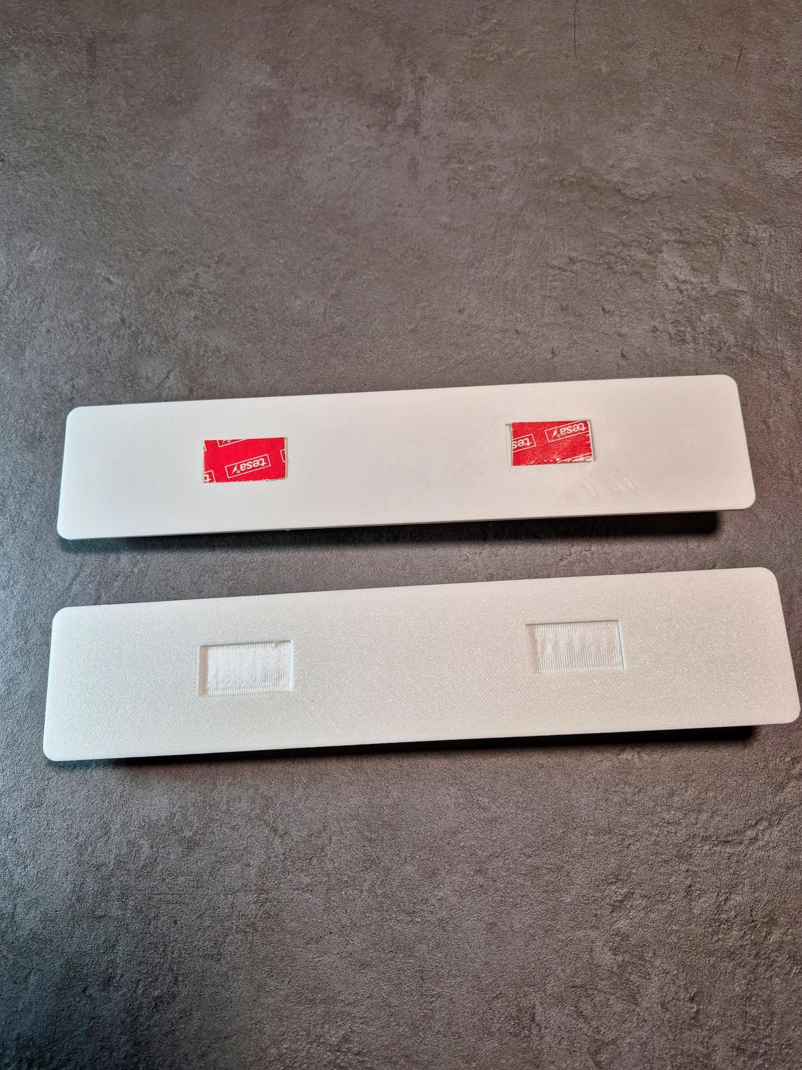 Holder base with 3M adhesive strips ready to mount