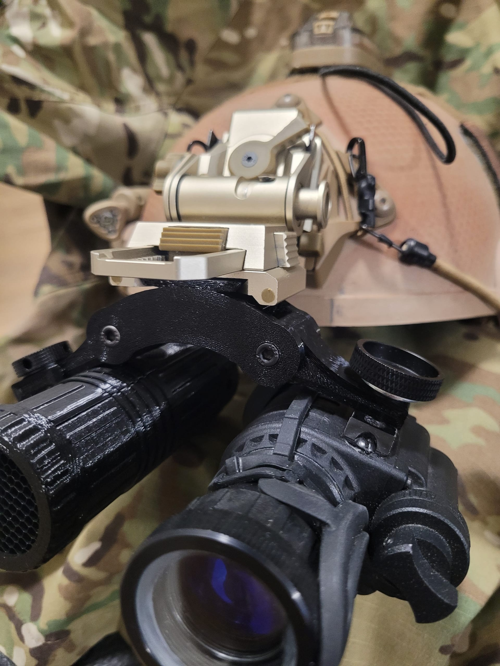 NVG bridge with night vision optics attached, multicam background