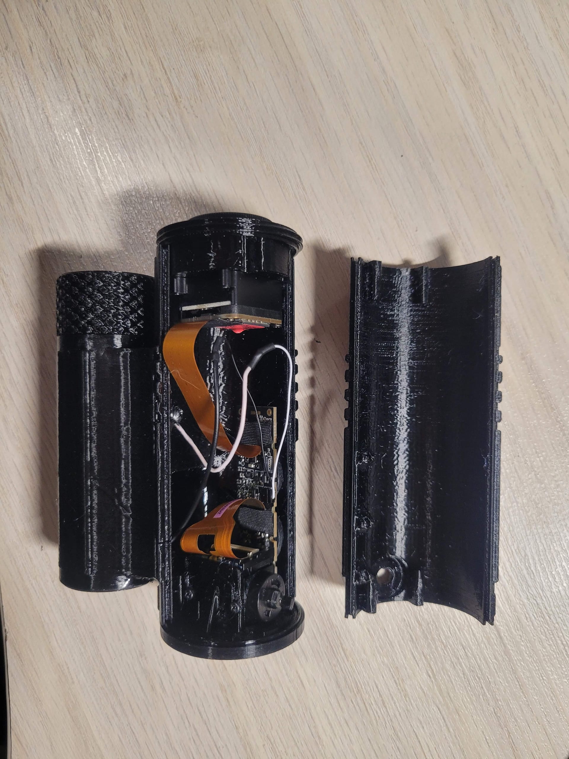 Housing open showing internal PCB and cable routing