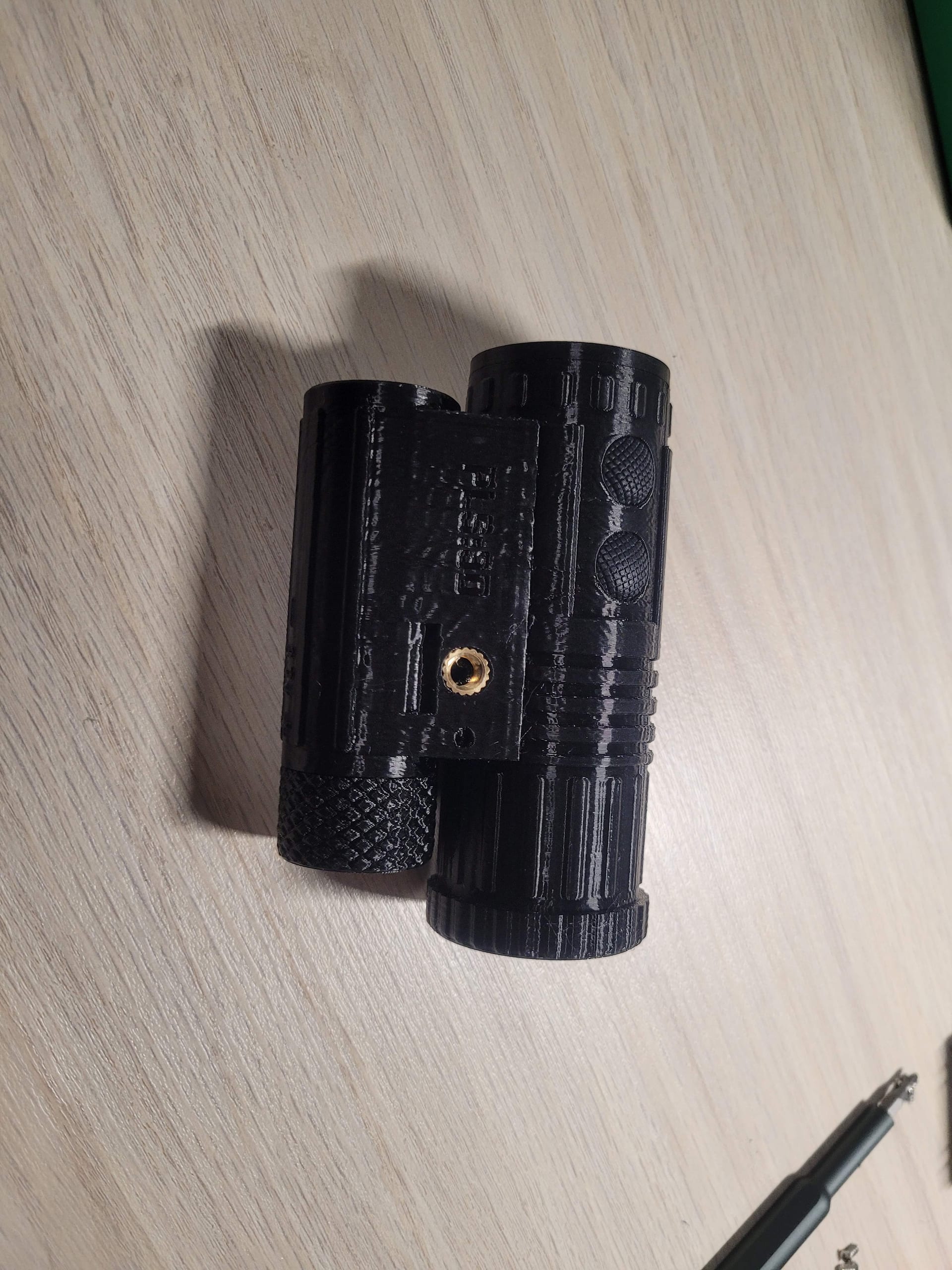 Assembled housing front view with lens
