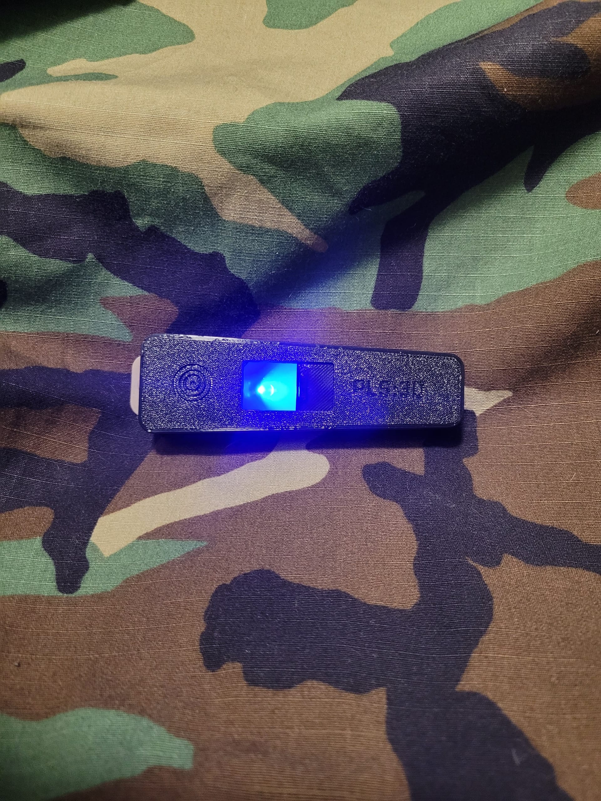 V-Lite light cover close-up on camo fabric, narrow blue light slit