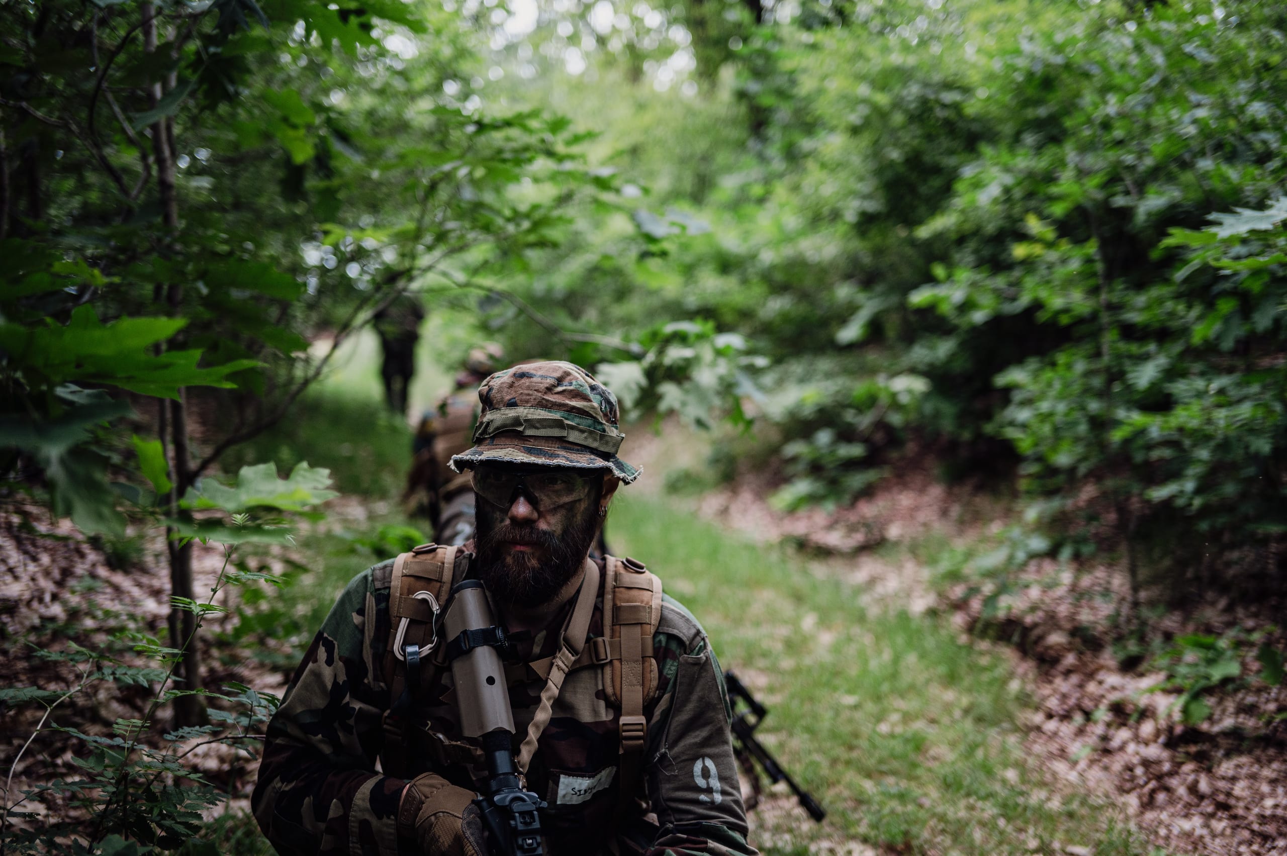 Leading patrol through forest